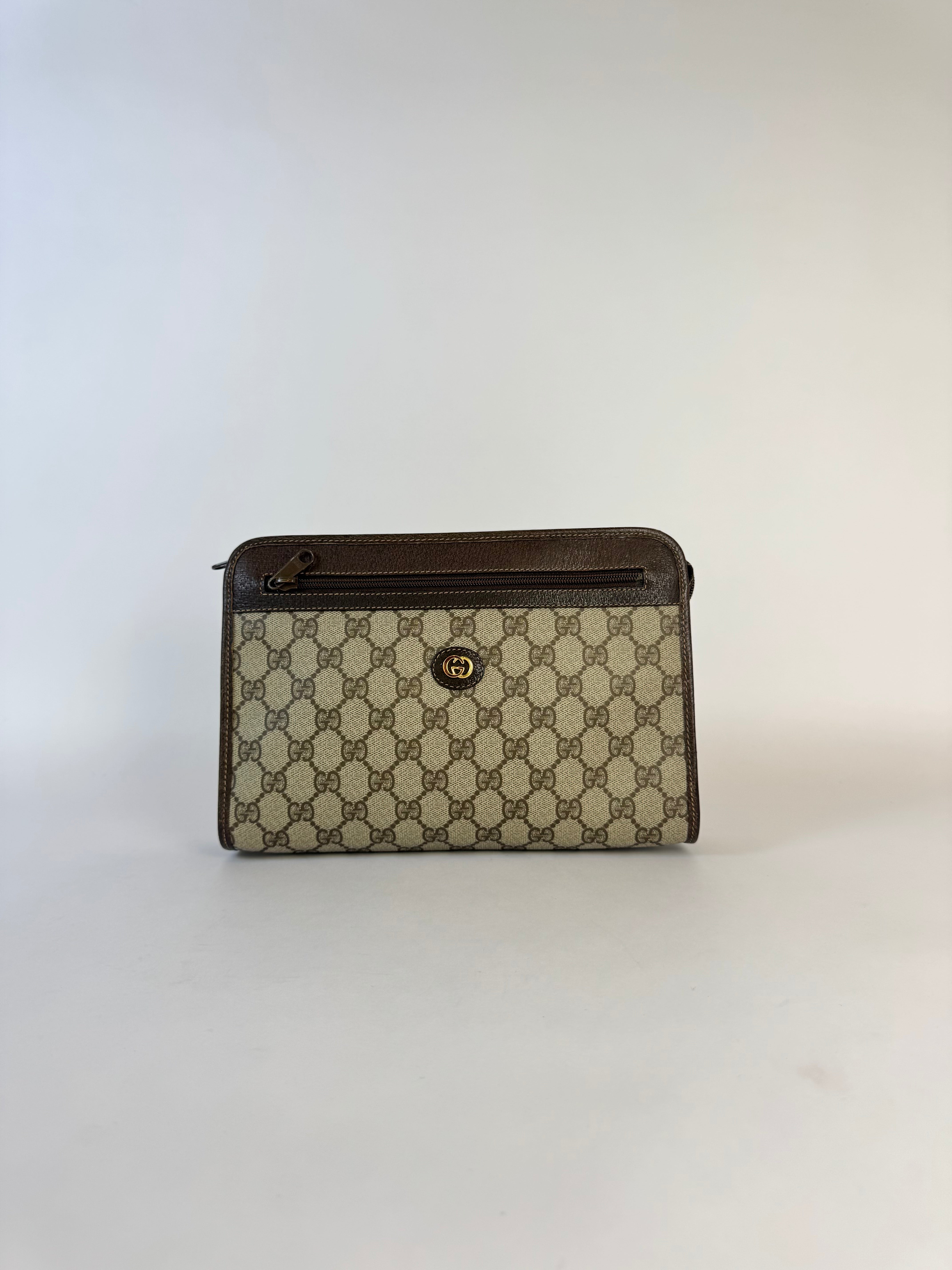 Gucci Monogrammed Canvas Clutch