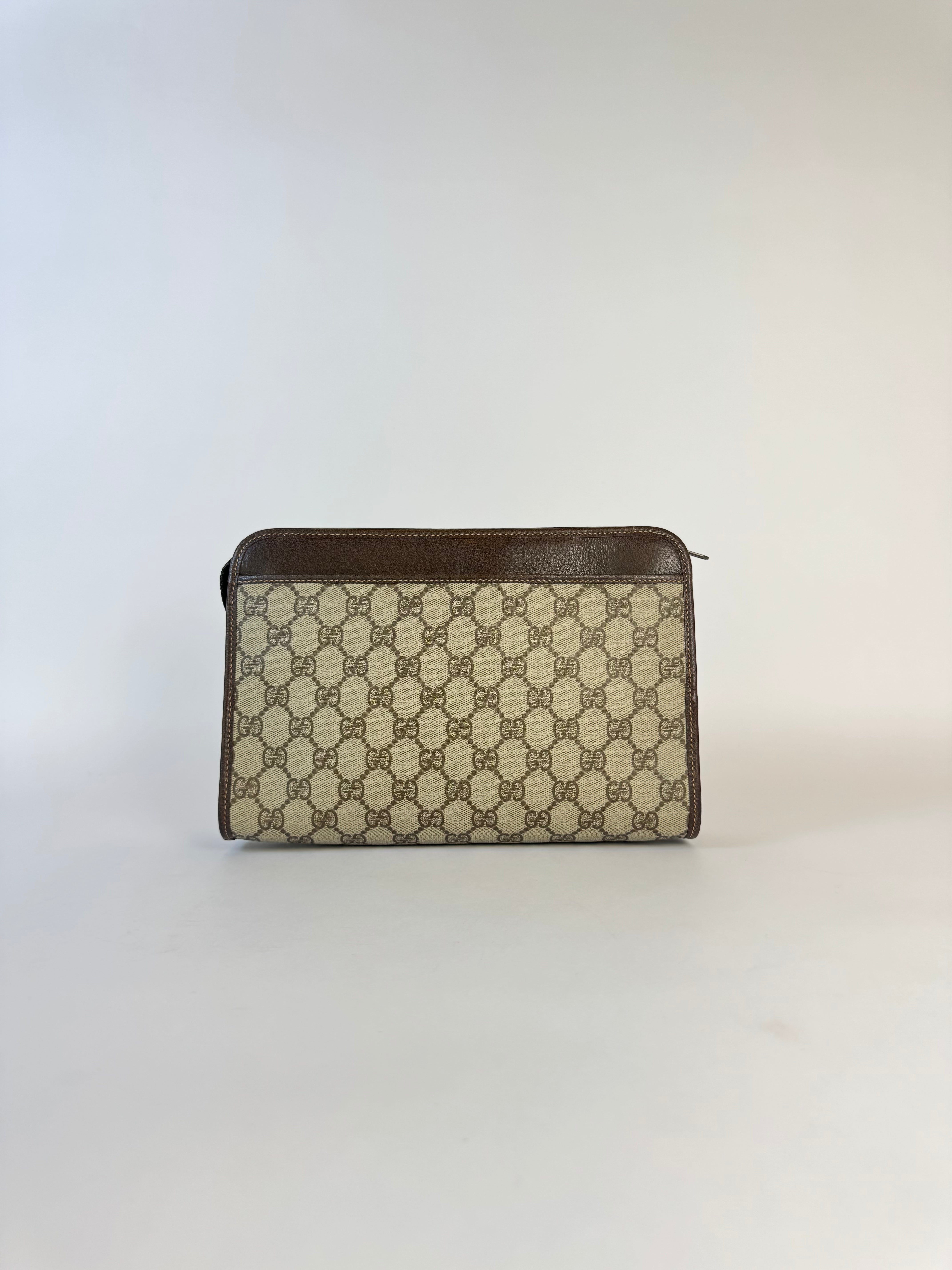 Gucci Monogrammed Canvas Clutch