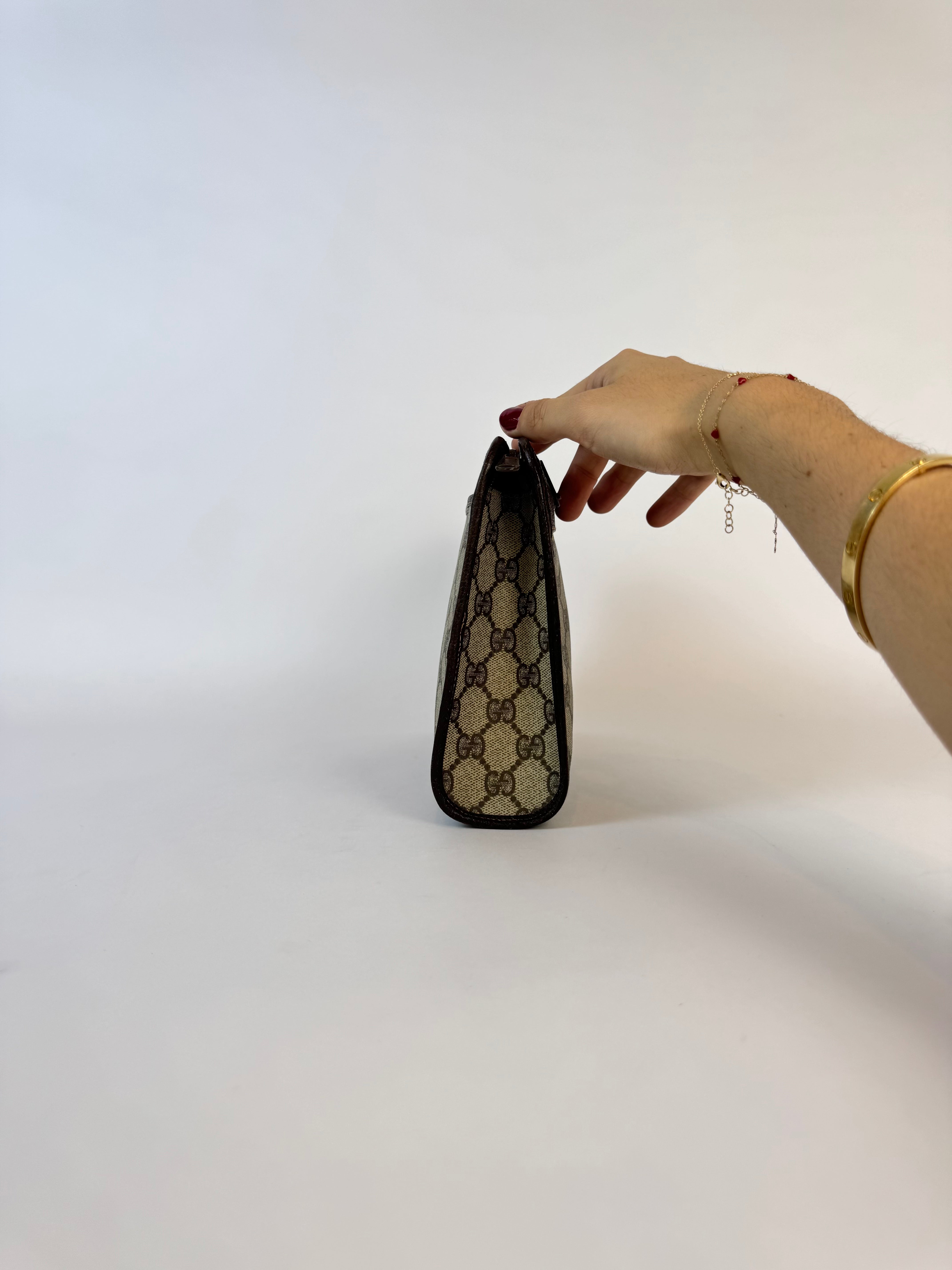 Gucci Monogrammed Canvas Clutch