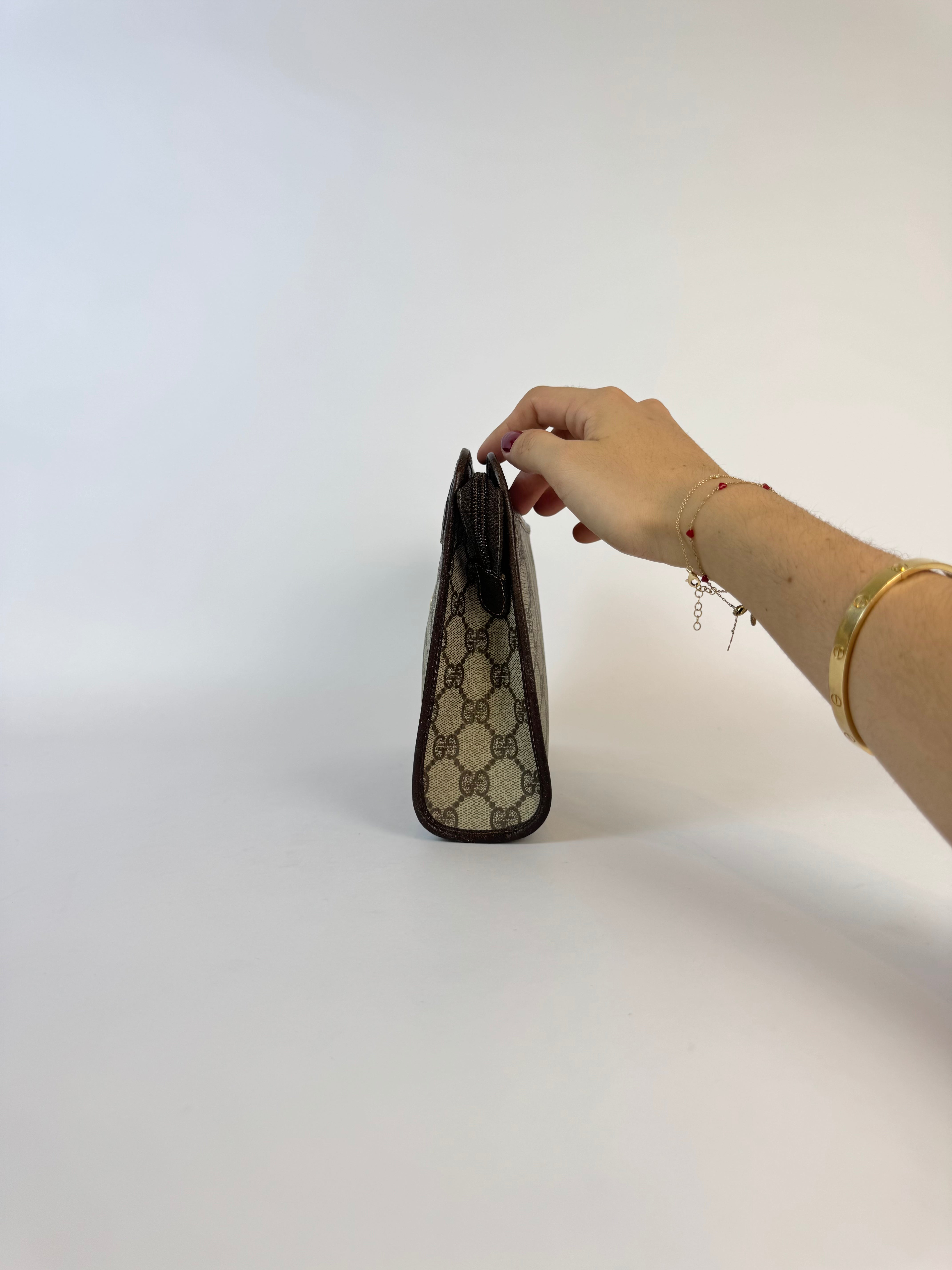 Gucci Monogrammed Canvas Clutch