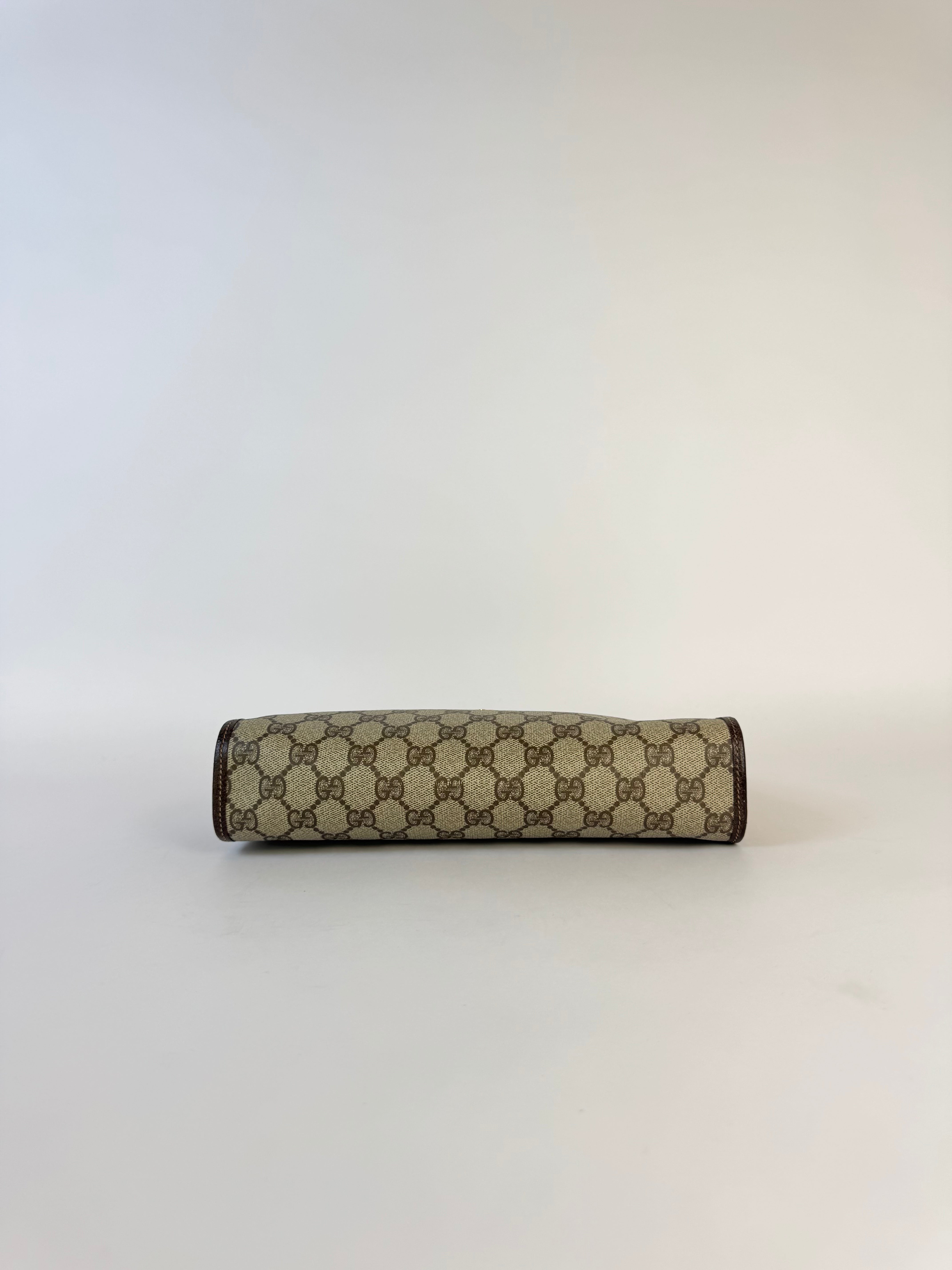 Gucci Monogrammed Canvas Clutch