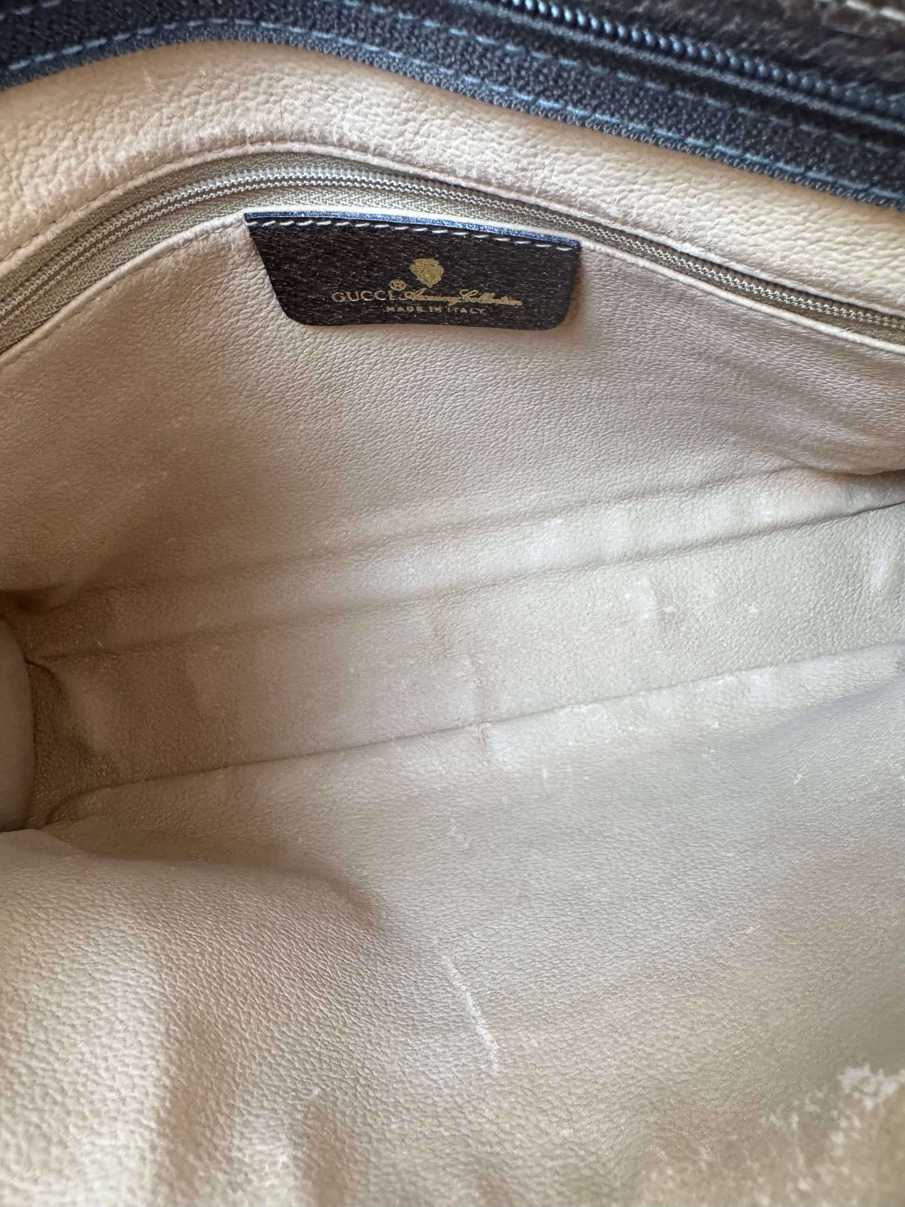 Gucci Monogrammed Canvas Clutch