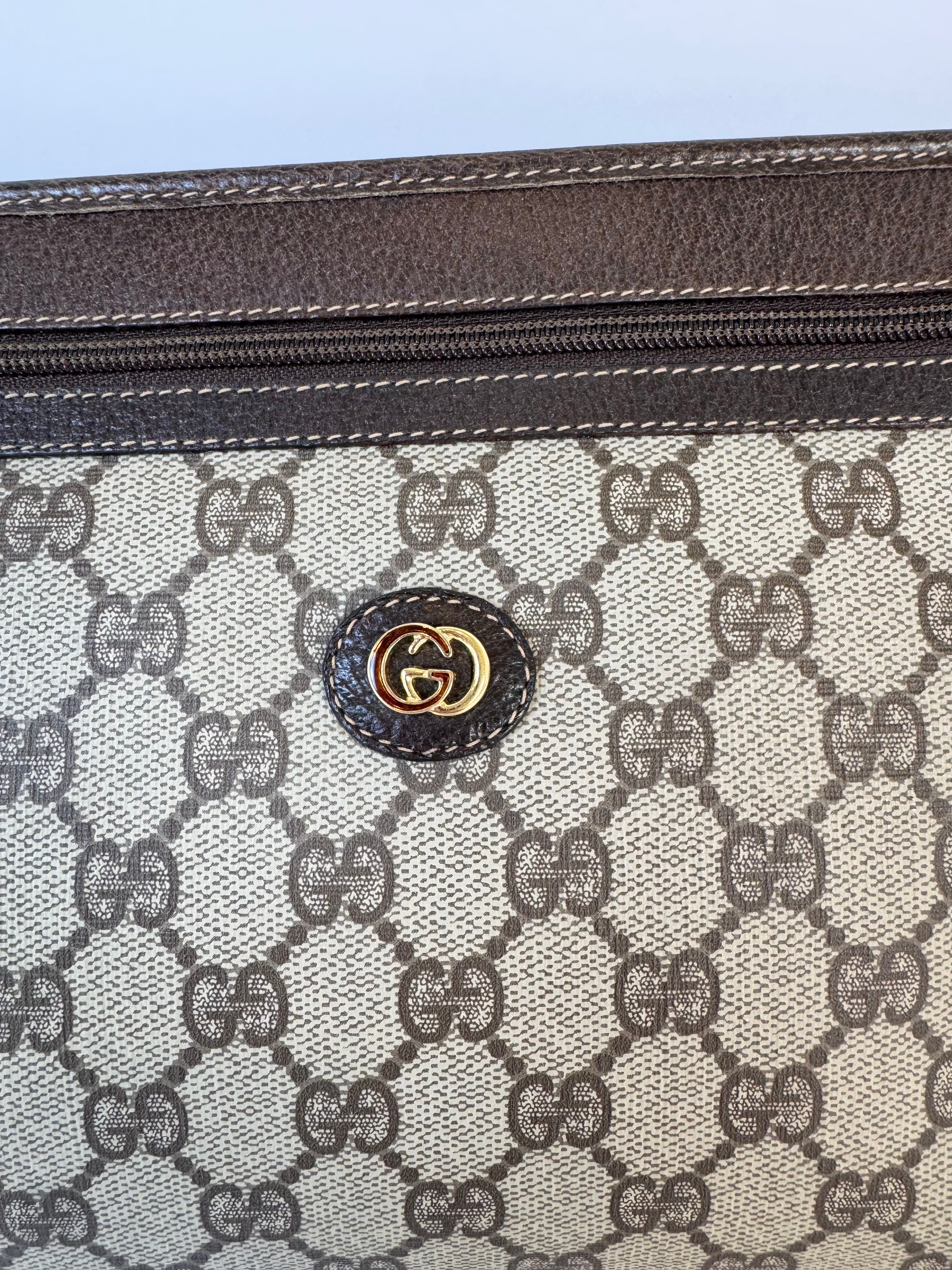 Gucci Monogrammed Canvas Clutch